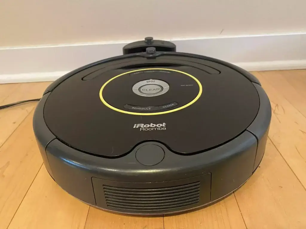 A Roomba sitting at its base station