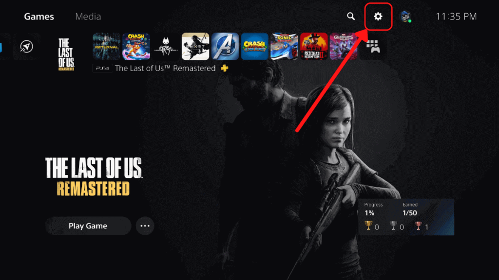 The PS5 home screen showing the settings button